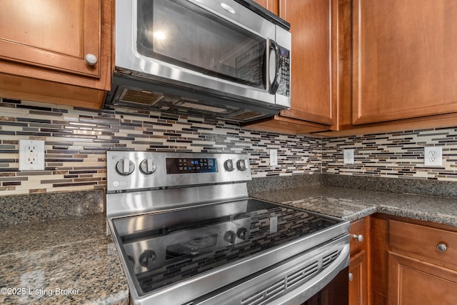 10008 Hornbeam Blvd, Louisville, KY 40228 - kitchen with appliances with stainless steel finishes, tasteful backsplash, and brown cabinetry