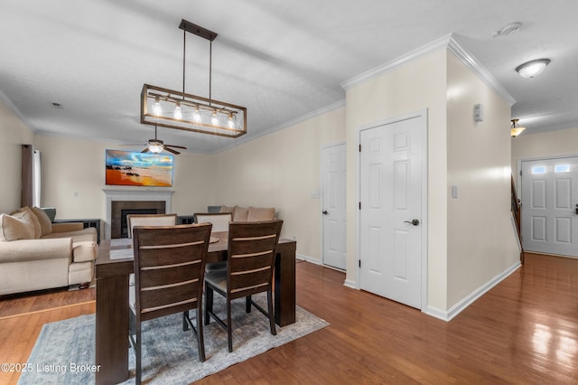 10008 Hornbeam Blvd, Louisville, KY 40228 - dining space featuring ornamental molding, ceiling fan, wood finished floors, and a fireplace