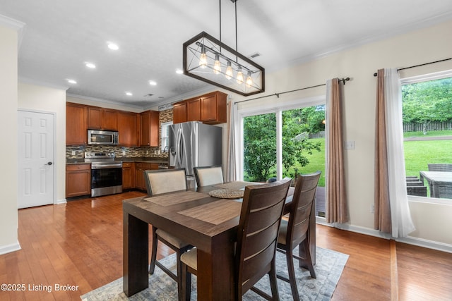 10008 Hornbeam Blvd, Louisville, KY 40228 - dining area featuring ornamental molding, recessed lighting, and wood finished floors