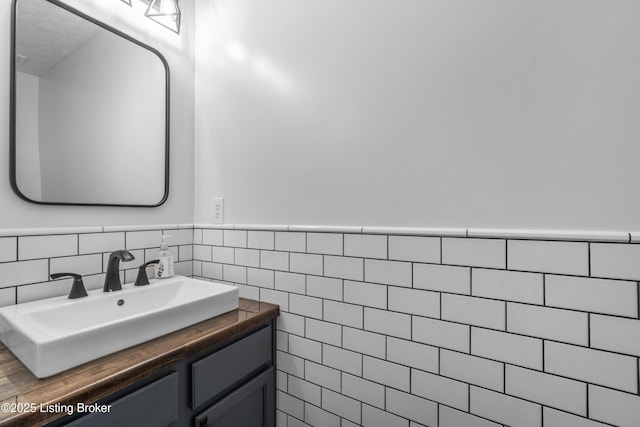 10008 Hornbeam Blvd, Louisville, KY 40228 - bathroom with vanity, wainscoting, and tile walls