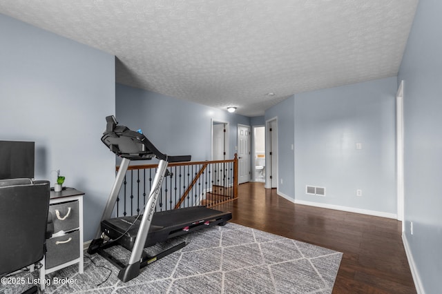 10008 Hornbeam Blvd, Louisville, KY 40228 - workout room featuring wood finished floors and a textured ceiling