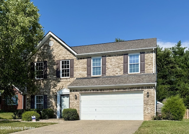 10008 Hornbeam Blvd, Louisville, KY 40228 - traditional home featuring an attached garage, driveway, brick siding, and roof with shingles
