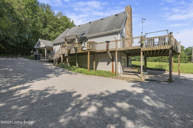 4333 Wax Rd, Clarkson, KY 42726 - back of property with a wooden deck, a chimney, and a patio area