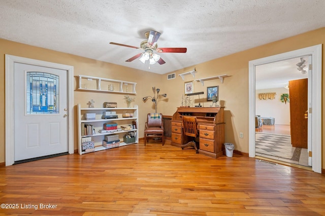 4333 Wax Rd, Clarkson, KY 42726 - home office featuring ceiling fan, light wood-style floors, and a textured ceiling