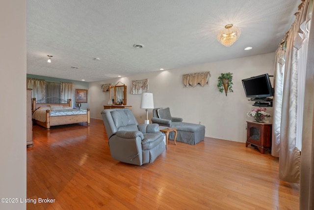 4333 Wax Rd, Clarkson, KY 42726 - living room with light wood-style flooring, recessed lighting, and a chandelier