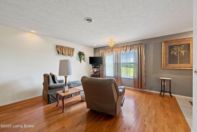 4333 Wax Rd, Clarkson, KY 42726 - living room with light wood-type flooring and a textured ceiling