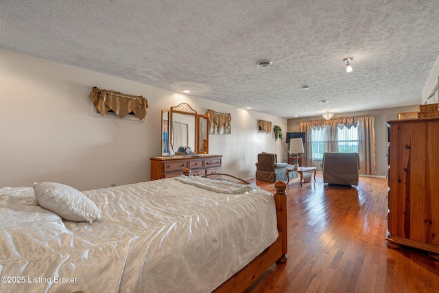 4333 Wax Rd, Clarkson, KY 42726 - bedroom with hardwood / wood-style flooring and a textured ceiling