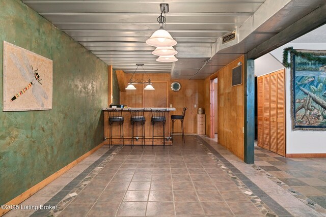 4333 Wax Rd, Clarkson, KY 42726 - unfurnished dining area featuring a dry bar and inlaid floor details