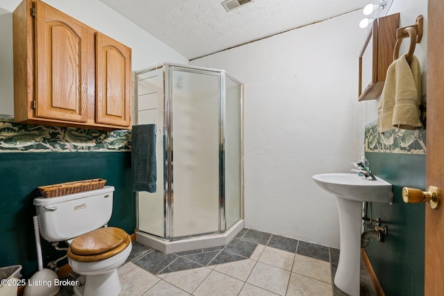 4333 Wax Rd, Clarkson, KY 42726 - bathroom featuring a textured ceiling, a shower stall, and tile patterned floors