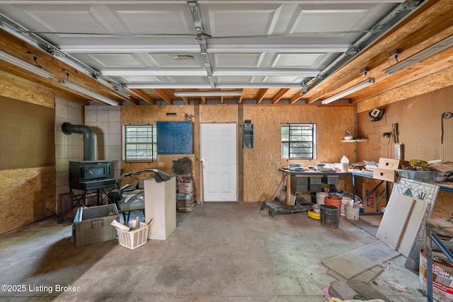 4333 Wax Rd, Clarkson, KY 42726 - garage featuring a wood stove and a workshop area