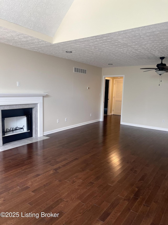 9403 Alex Ct, Louisville, KY 40299 - unfurnished living room with a textured ceiling, a fireplace, ceiling fan, and dark wood-style floors
