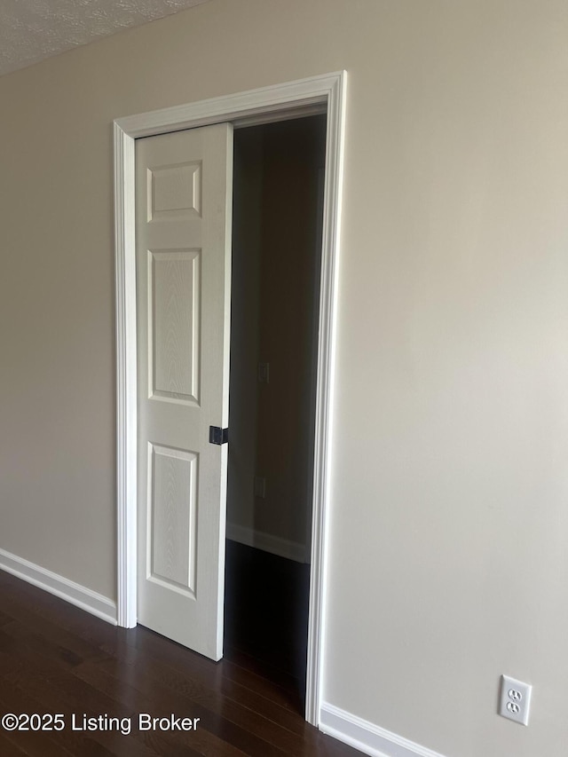 9403 Alex Ct, Louisville, KY 40299 - unfurnished room with dark wood-style flooring and baseboards