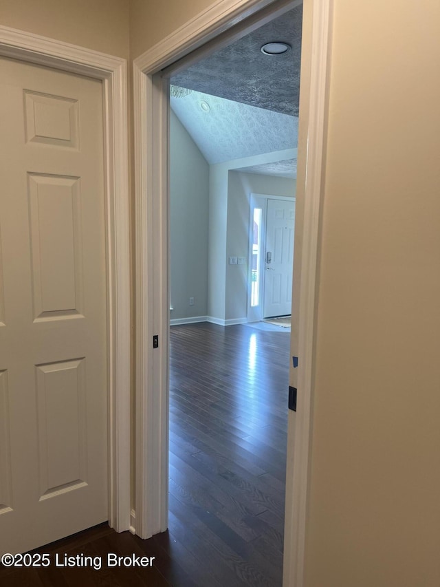 9403 Alex Ct, Louisville, KY 40299 - hallway featuring dark wood finished floors and vaulted ceiling