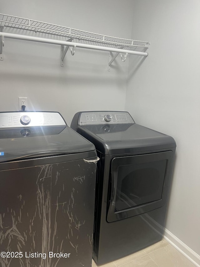 9403 Alex Ct, Louisville, KY 40299 - washroom featuring washer and dryer and tile patterned floors