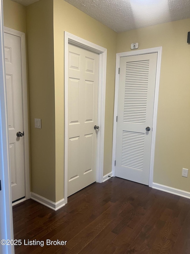 9403 Alex Ct, Louisville, KY 40299 - hall featuring dark wood-style floors and a textured ceiling