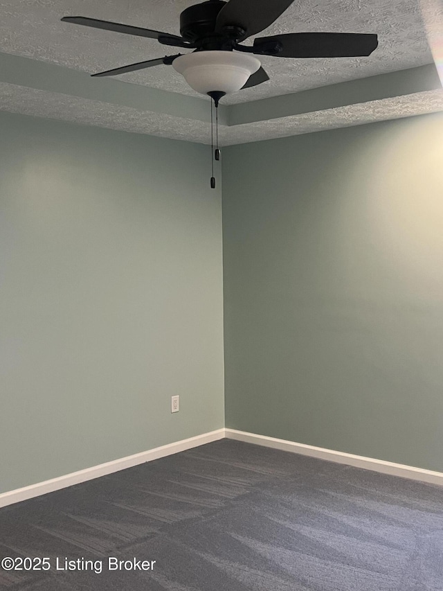 9403 Alex Ct, Louisville, KY 40299 - unfurnished room with dark carpet, ceiling fan, and a textured ceiling