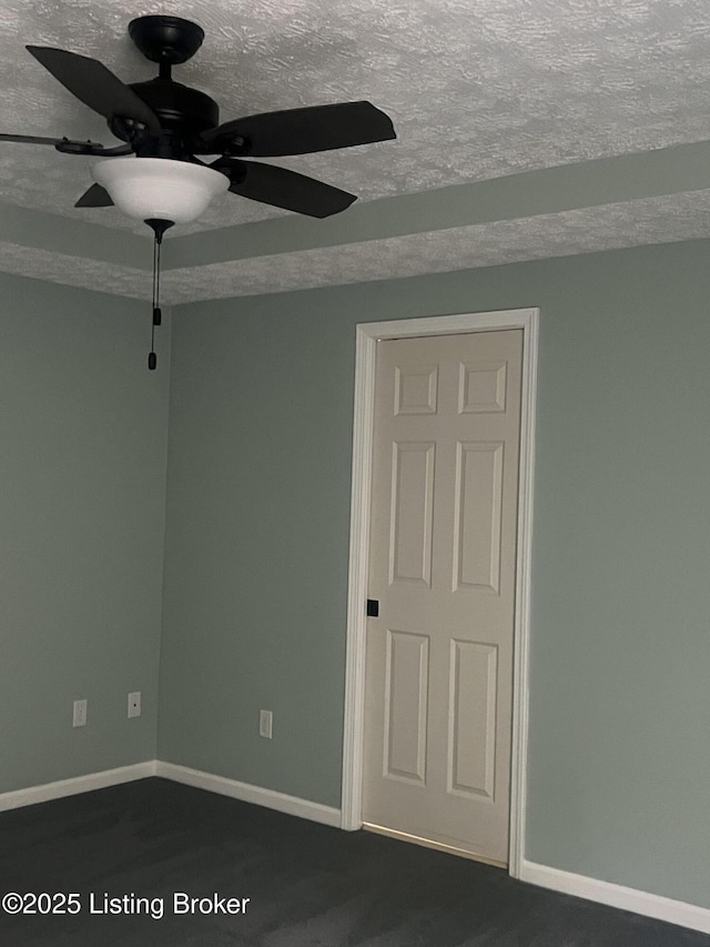 9403 Alex Ct, Louisville, KY 40299 - spare room with a ceiling fan, a textured ceiling, and dark carpet