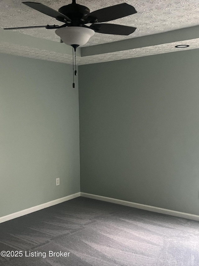 9403 Alex Ct, Louisville, KY 40299 - empty room featuring dark carpet, ceiling fan, and a textured ceiling