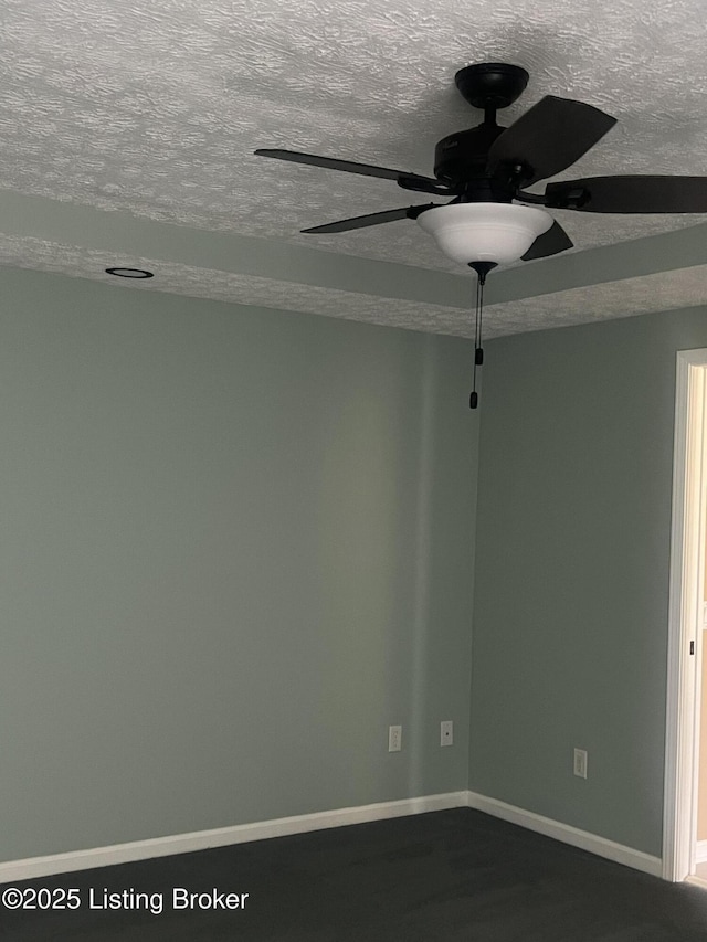 9403 Alex Ct, Louisville, KY 40299 - unfurnished room with a textured ceiling, a ceiling fan, and dark wood-type flooring