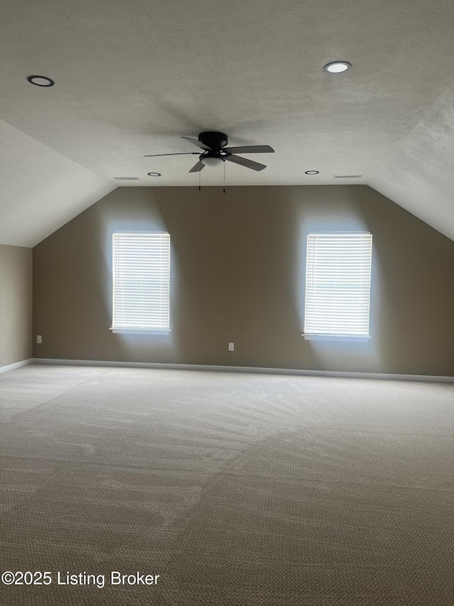 9403 Alex Ct, Louisville, KY 40299 - additional living space featuring lofted ceiling, carpet, plenty of natural light, a ceiling fan, and recessed lighting