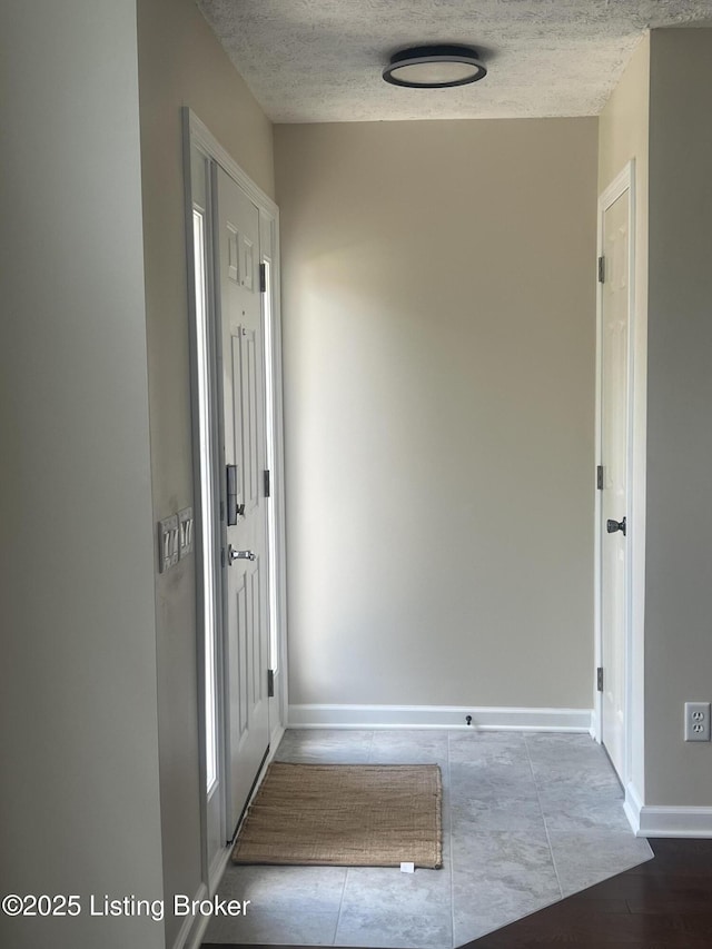 9403 Alex Ct, Louisville, KY 40299 - corridor with baseboards and a textured ceiling