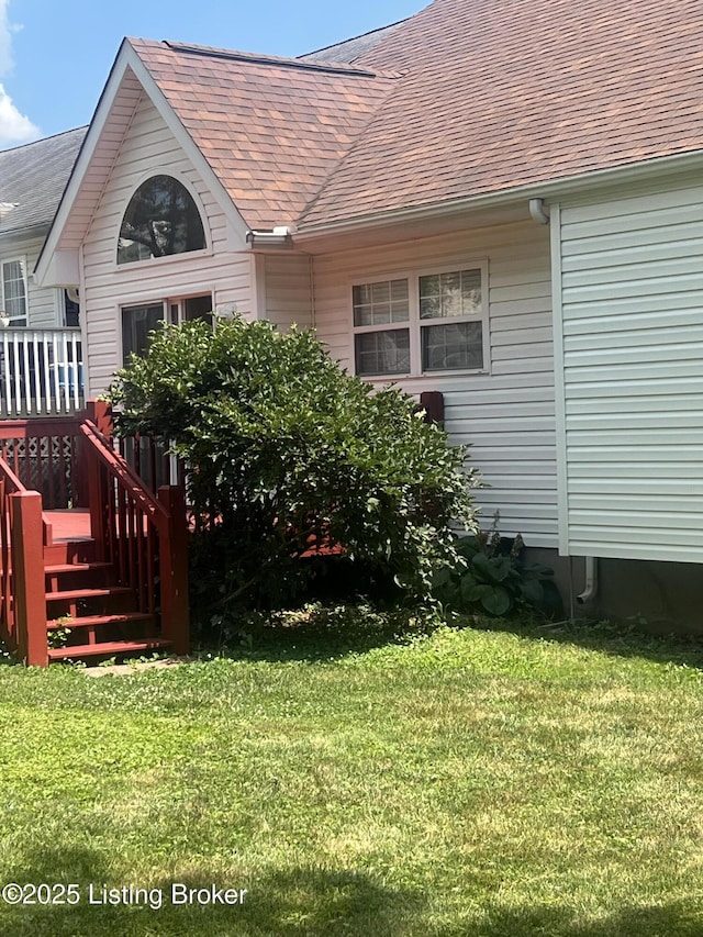 9403 Alex Ct, Louisville, KY 40299 - rear view of house with a shingled roof, a lawn, and a deck