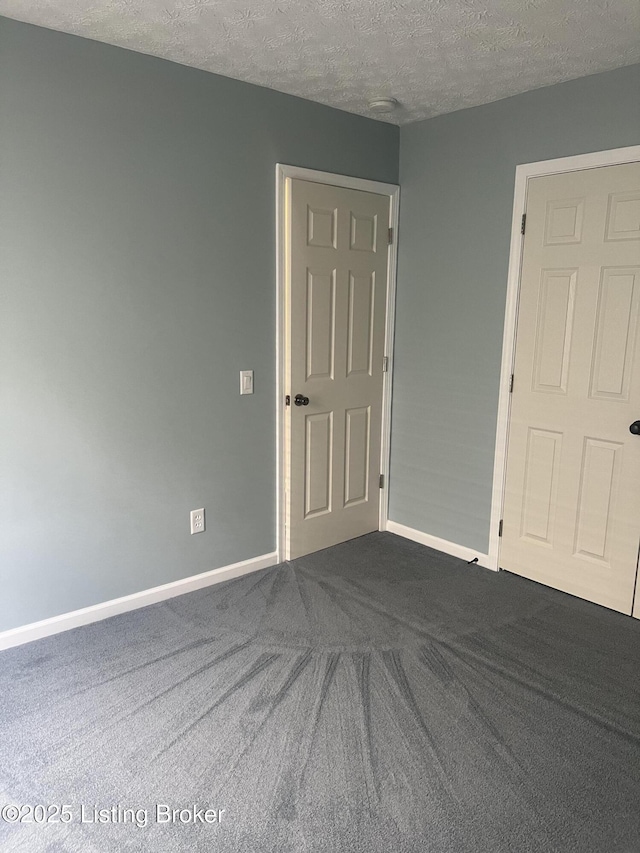 9403 Alex Ct, Louisville, KY 40299 - spare room with dark carpet and a textured ceiling