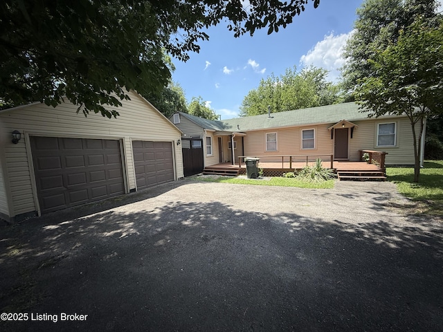 934 Palatka Rd, Louisville, KY 40214 - view of front of house with a deck and an outbuilding