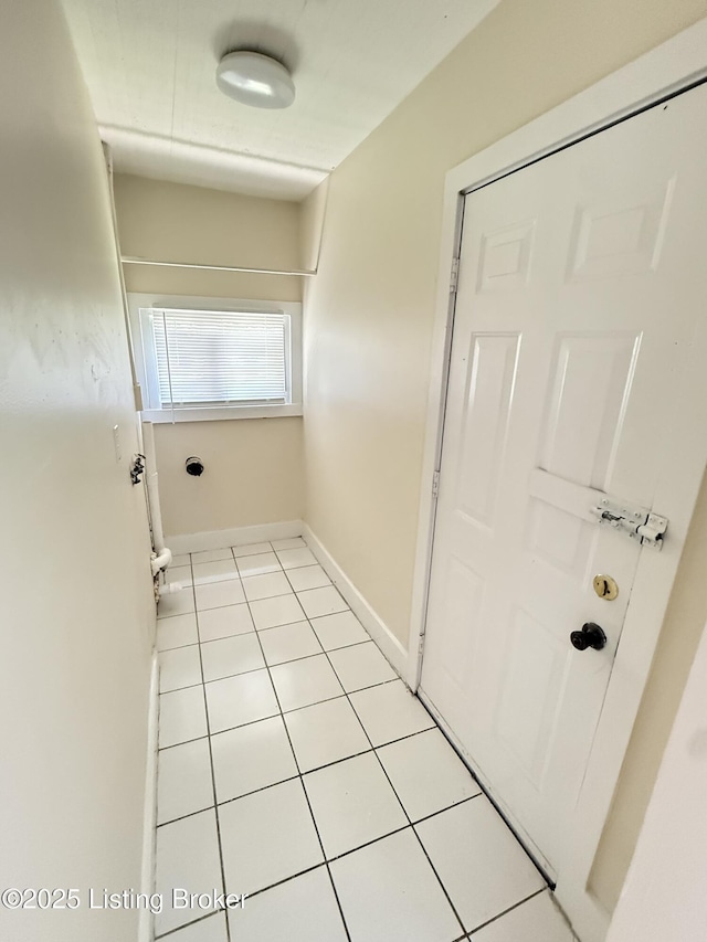934 Palatka Rd, Louisville, KY 40214 - laundry area with light tile patterned floors and baseboards