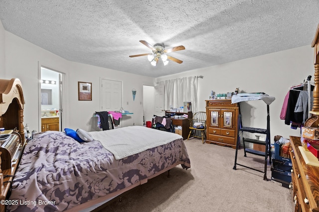 1291 Lipps Ln, Louisville, KY 40219 - bedroom featuring light colored carpet, ceiling fan, ensuite bathroom, and a textured ceiling