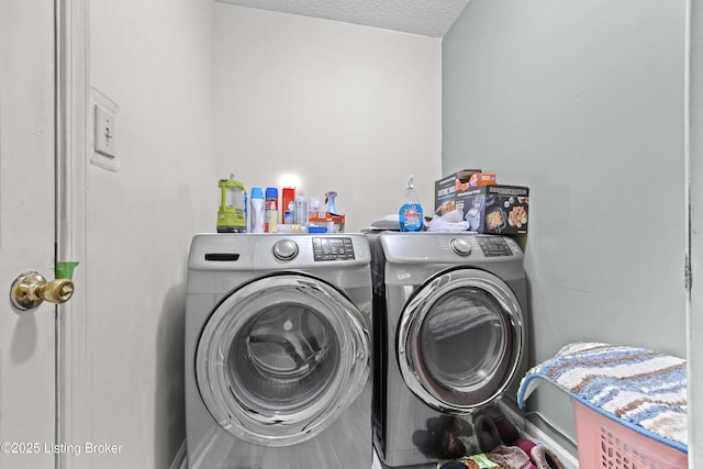 1291 Lipps Ln, Louisville, KY 40219 - washroom with washing machine and dryer and a textured ceiling