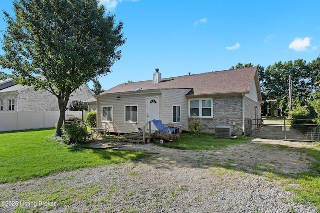 1291 Lipps Ln, Louisville, KY 40219 - back of property with a chimney, brick siding, and a shingled roof