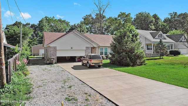 1291 Lipps Ln, Louisville, KY 40219 - view of front facade with an attached garage, driveway, and brick siding