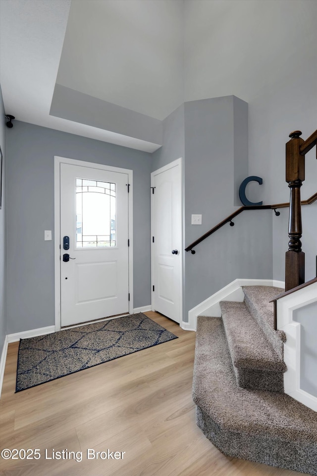 124 Shadow Rock Ct, Shepherdsville, KY 40165 - foyer entrance featuring light wood finished floors and stairs