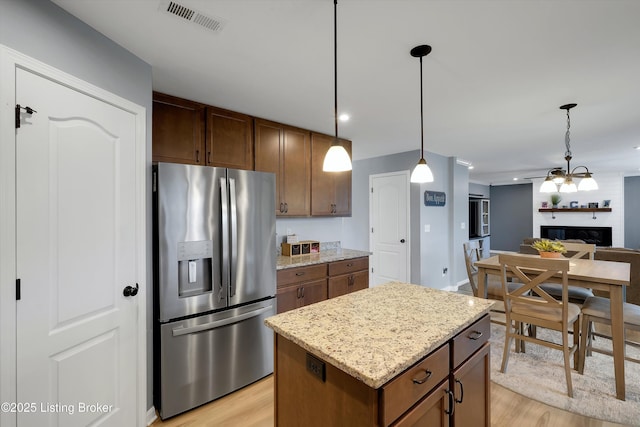 124 Shadow Rock Ct, Shepherdsville, KY 40165 - kitchen featuring stainless steel refrigerator with ice dispenser, light wood-style floors, pendant lighting, and recessed lighting