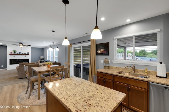 124 Shadow Rock Ct, Shepherdsville, KY 40165 - kitchen with stainless steel dishwasher, light wood-type flooring, plenty of natural light, a center island, and recessed lighting