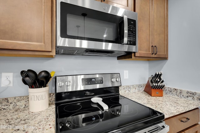124 Shadow Rock Ct, Shepherdsville, KY 40165 - kitchen with stainless steel appliances, brown cabinets, and light stone counters