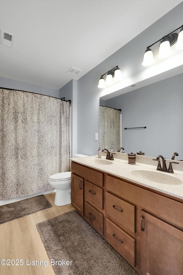 124 Shadow Rock Ct, Shepherdsville, KY 40165 - bathroom featuring wood finished floors and double vanity