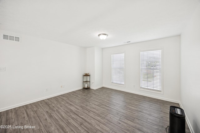 14433 Halden Ridge Way, Louisville, KY 40245 - empty room featuring dark wood-type flooring and baseboards