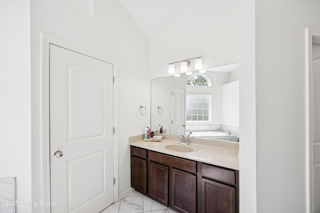 14433 Halden Ridge Way, Louisville, KY 40245 - full bath featuring lofted ceiling, marble look tiles, vanity, and a bath