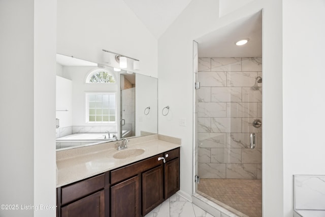 14433 Halden Ridge Way, Louisville, KY 40245 - bathroom with marble look tiles, a stall shower, vanity, vaulted ceiling, and a tub to relax in