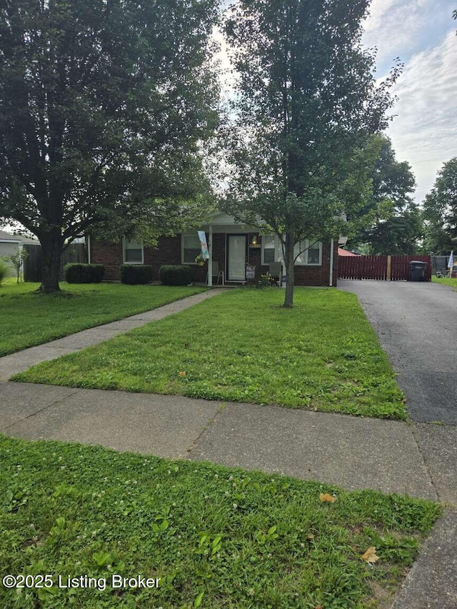 9907 Plaudit Way, Louisville, KY 40272 - view of property hidden behind natural elements featuring driveway