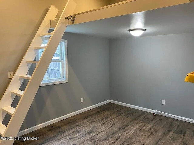 1214 Logan St, Louisville, KY 40204 - additional living space with dark wood-style flooring and baseboards