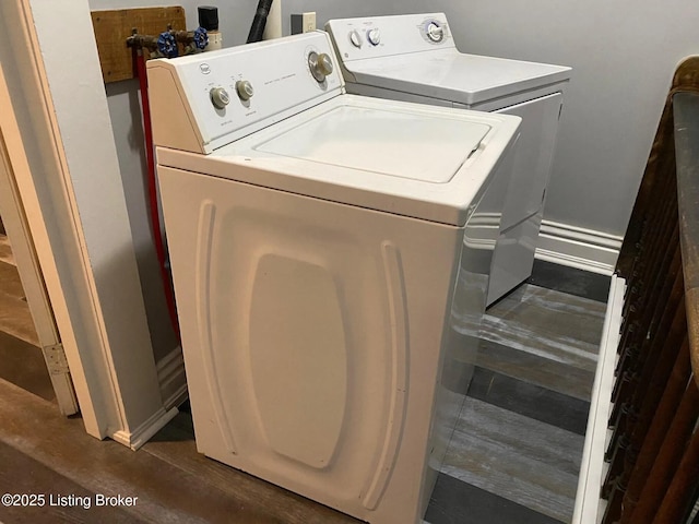 1214 Logan St, Louisville, KY 40204 - washroom with washing machine and dryer and dark wood-type flooring