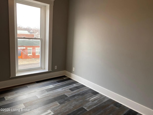 1214 Logan St, Louisville, KY 40204 - unfurnished room featuring healthy amount of natural light and dark wood-style floors