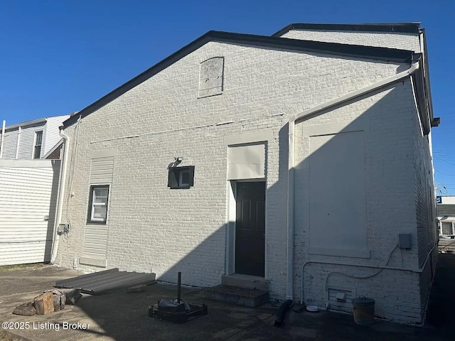 1214 Logan St, Louisville, KY 40204 - rear view of house with entry steps and brick siding