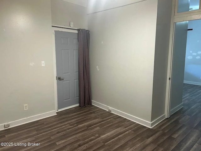 1214 Logan St, Louisville, KY 40204 - unfurnished room with dark wood-style flooring and baseboards