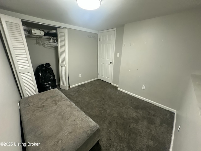 304 S 41st St, Louisville, KY 40212 - unfurnished bedroom with dark colored carpet and a closet