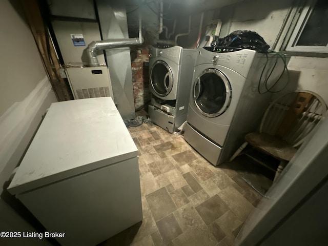 304 S 41st St, Louisville, KY 40212 - laundry room with washing machine and clothes dryer and stone finish flooring