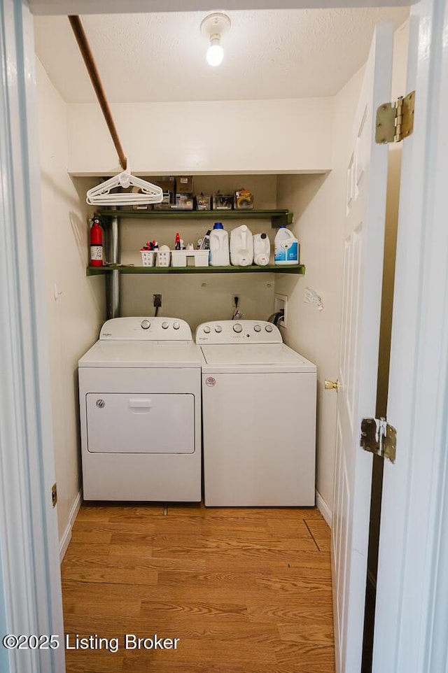6812 Holly Lake Dr, Louisville, KY 40291 - laundry room featuring independent washer and dryer and light wood-style flooring
